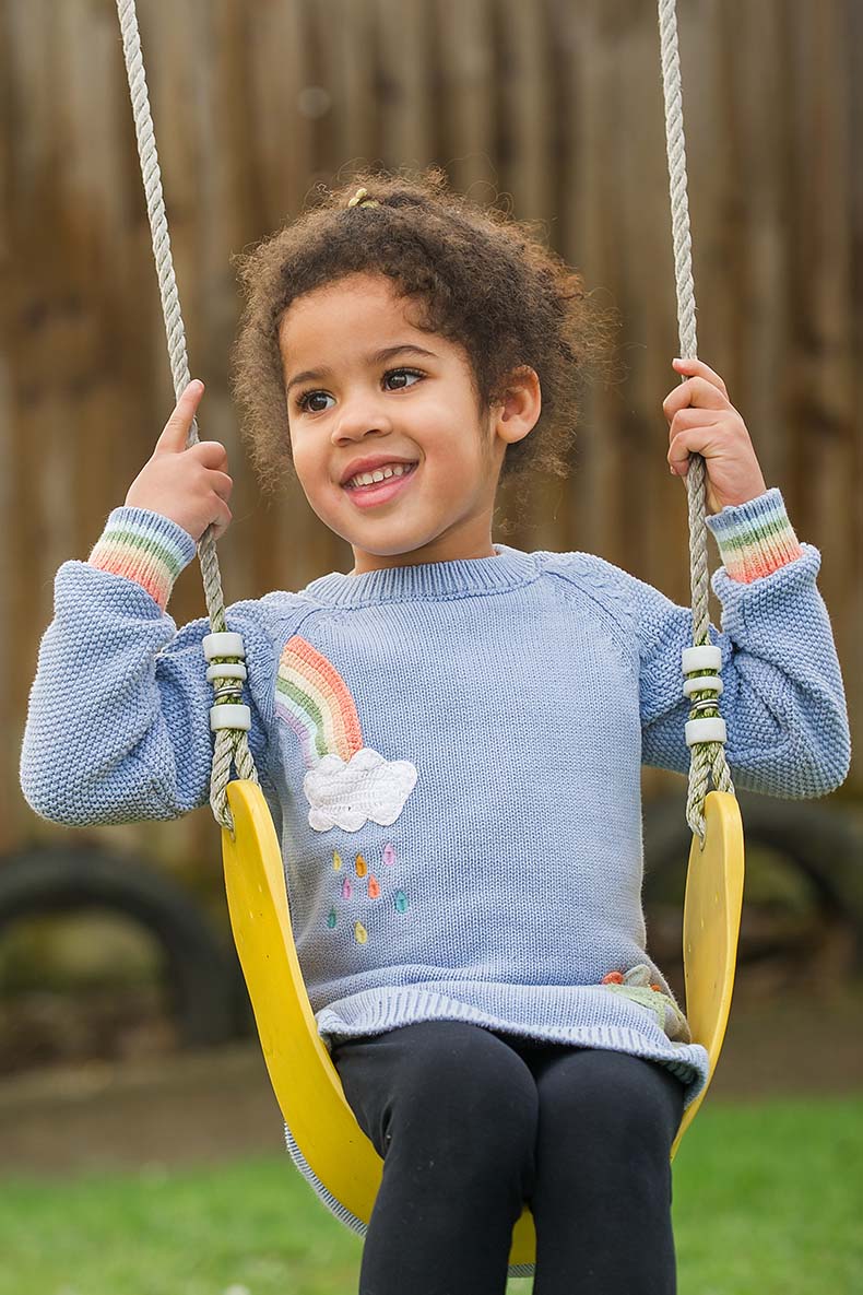 Happy girl on a swing