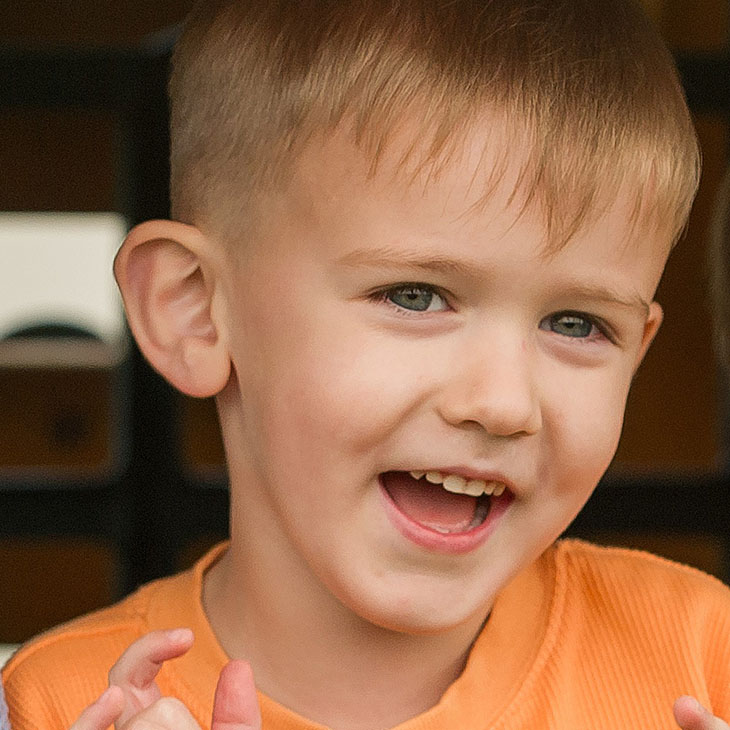 Happy boy with orange t-shirt