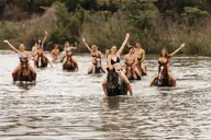 Horses and riders cooling off in the water