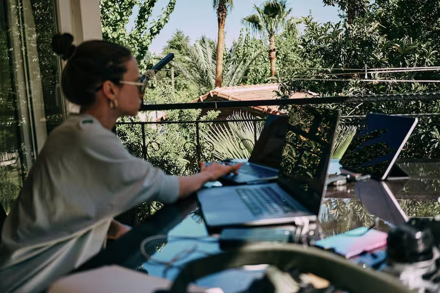 digital nomad working from laptops
