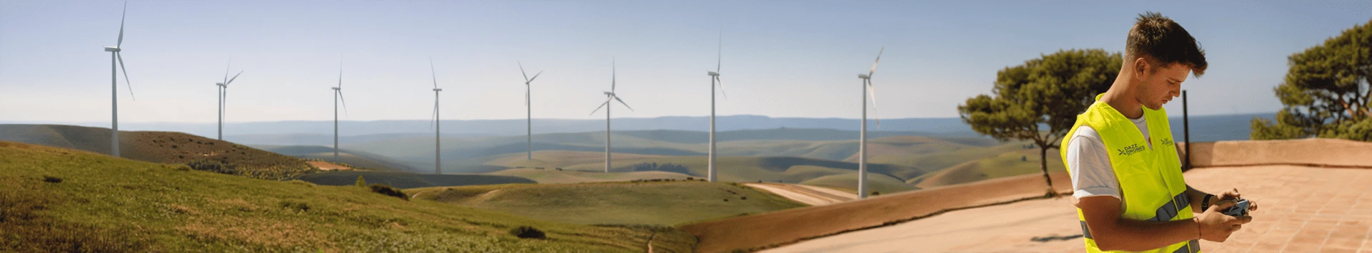 Dazz Drones pilot operating a drone for aerial surveying at a wind farm