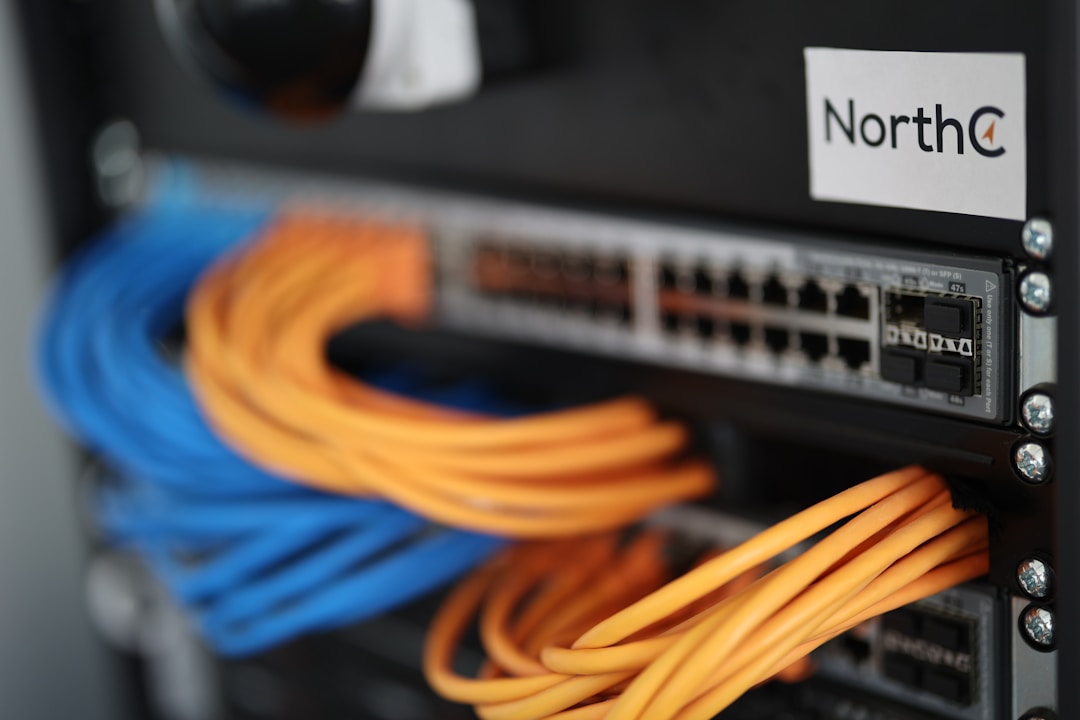 Network switch with blinking indicator lights in server rack