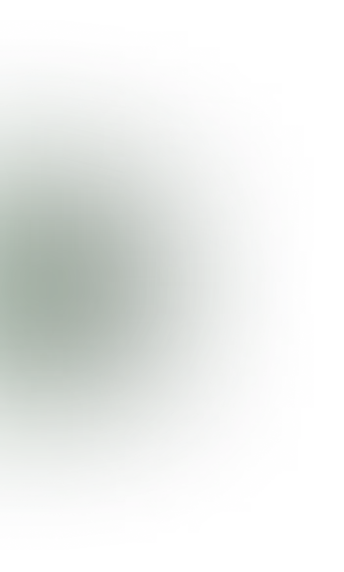 Green gradient oval shape with a blurred outer edge fading into black background.