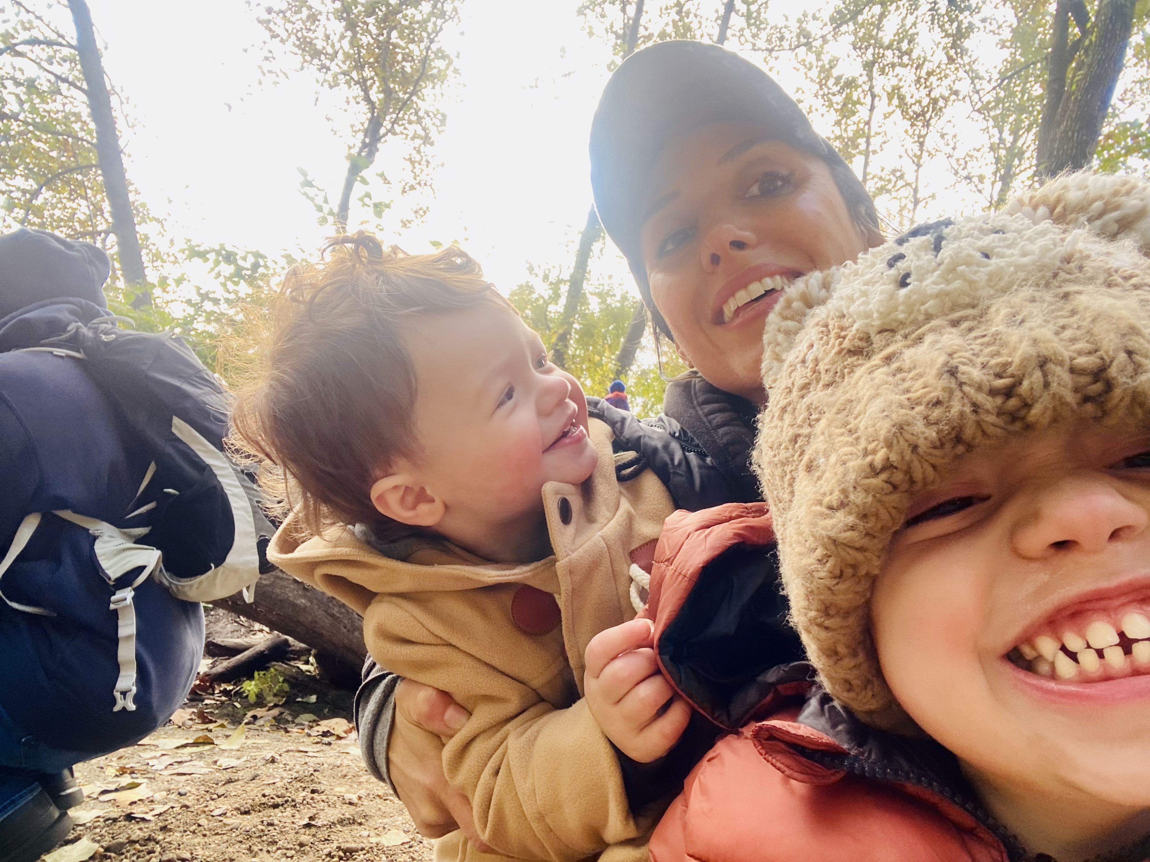 Lauren with her two young children outdoors