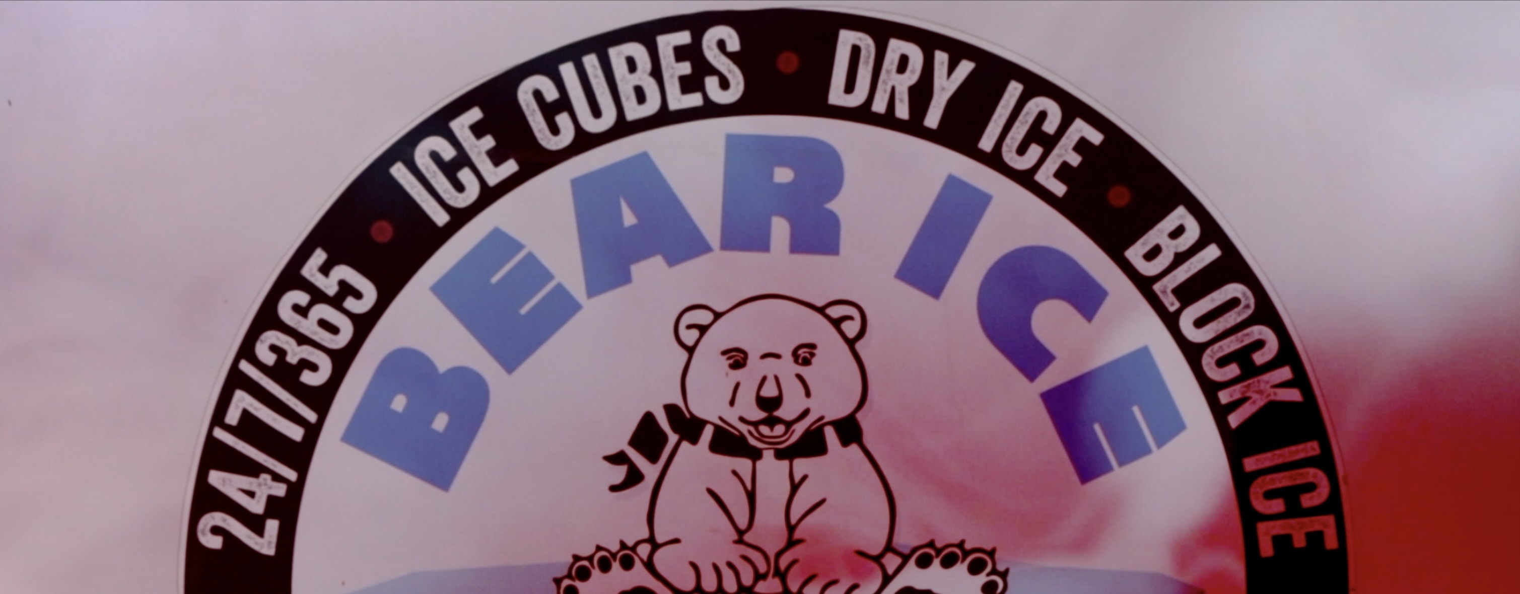 Corporate video still image logo over dry ice vapors
