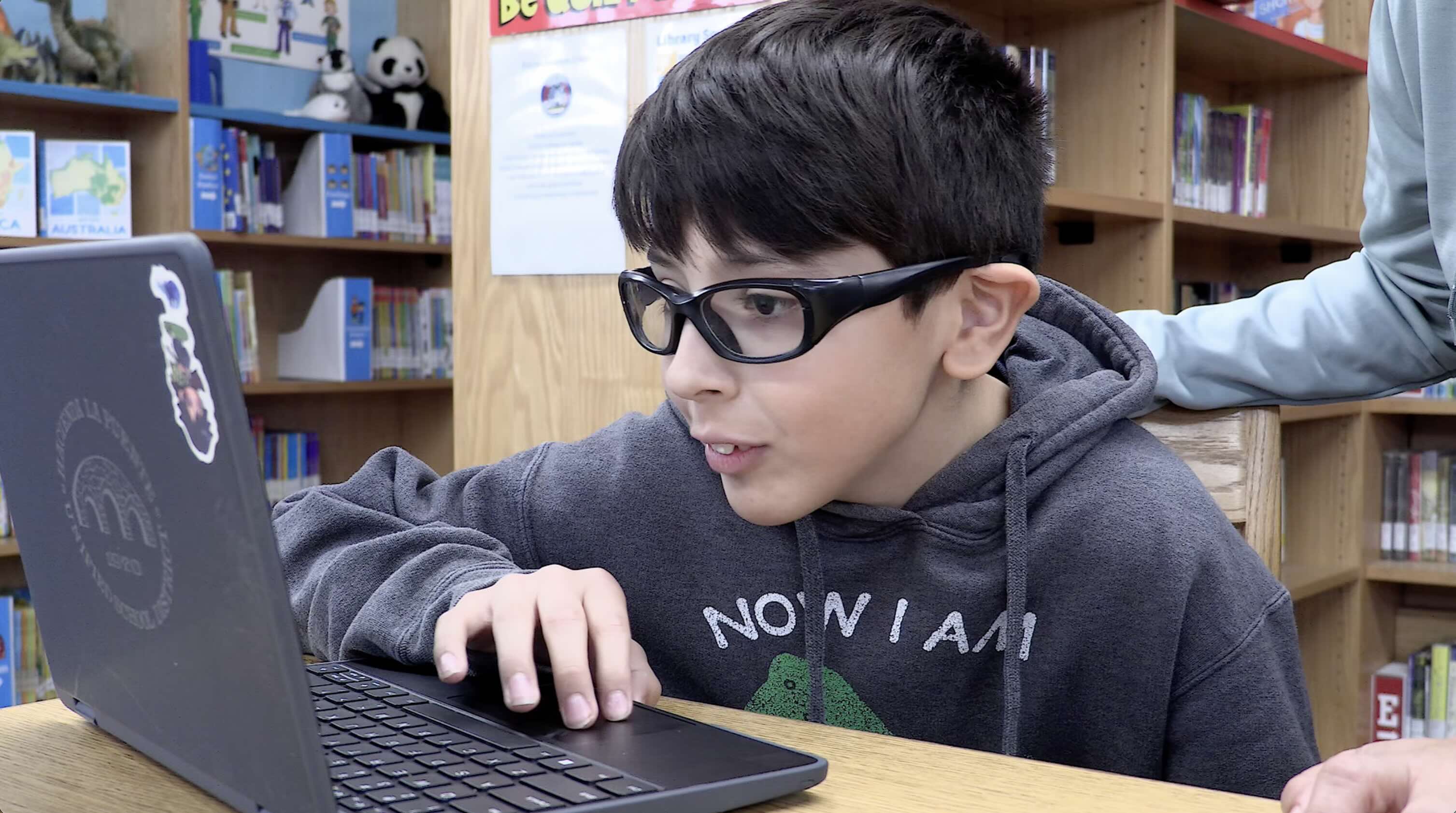 Young student using laptop during educational technology program