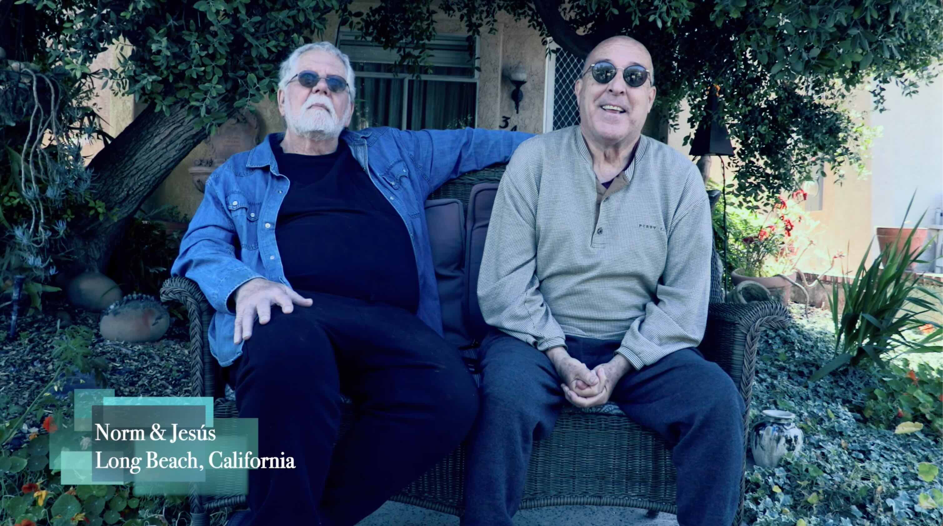 Two people seated outdoors during documentary-style interview