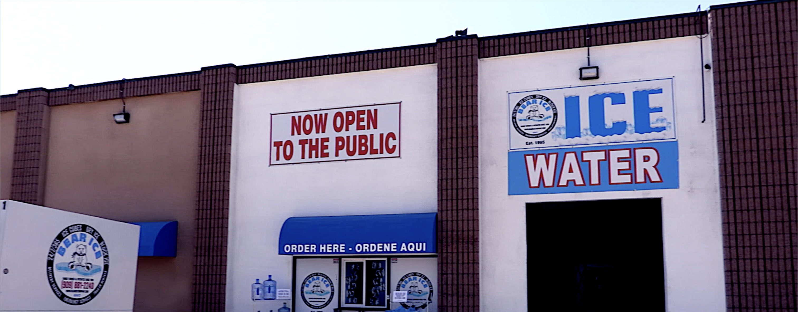 Exterior storefront with office and ice water signage