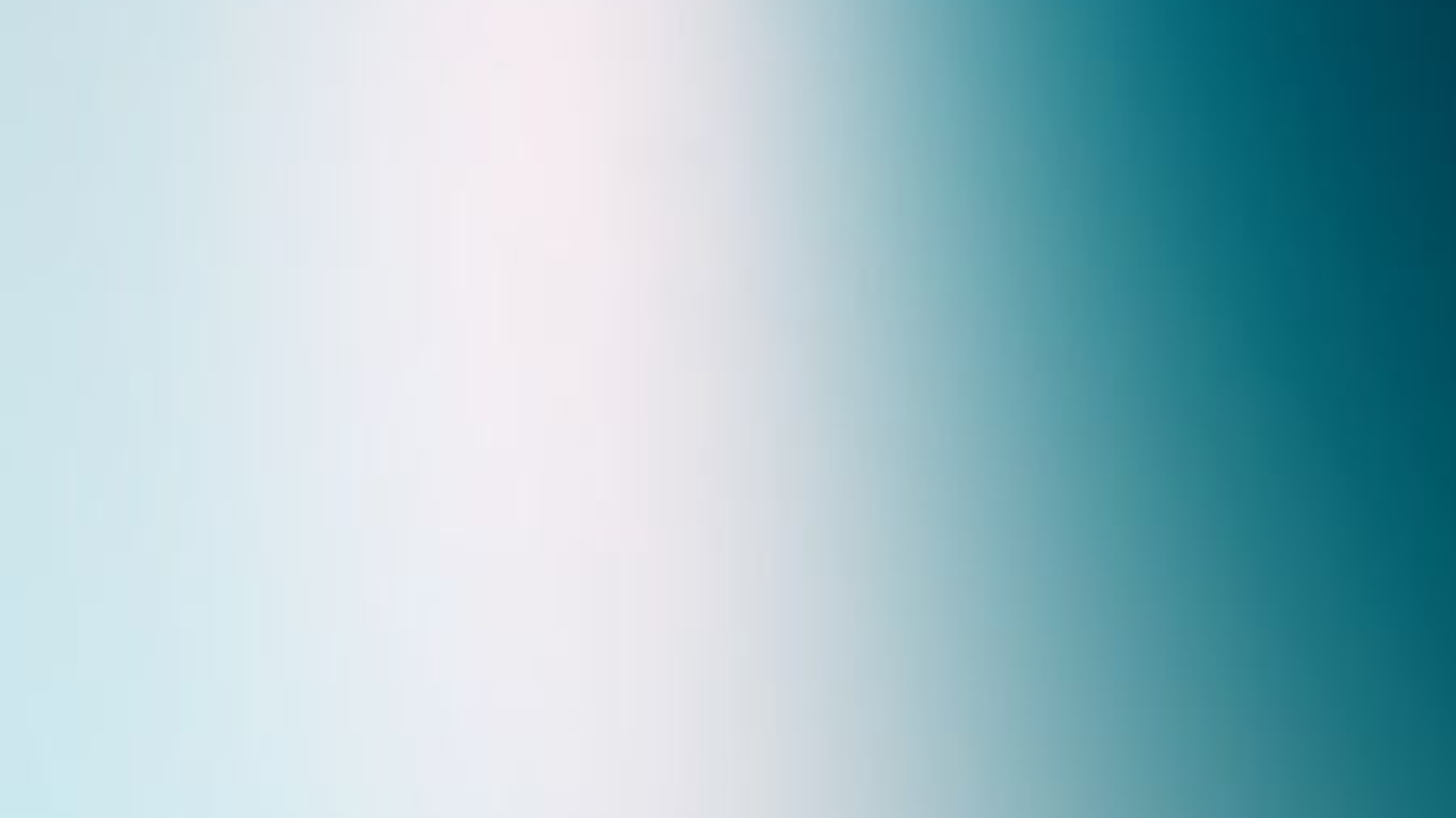 Close-up of a smooth, light-colored surface with soft shadows.