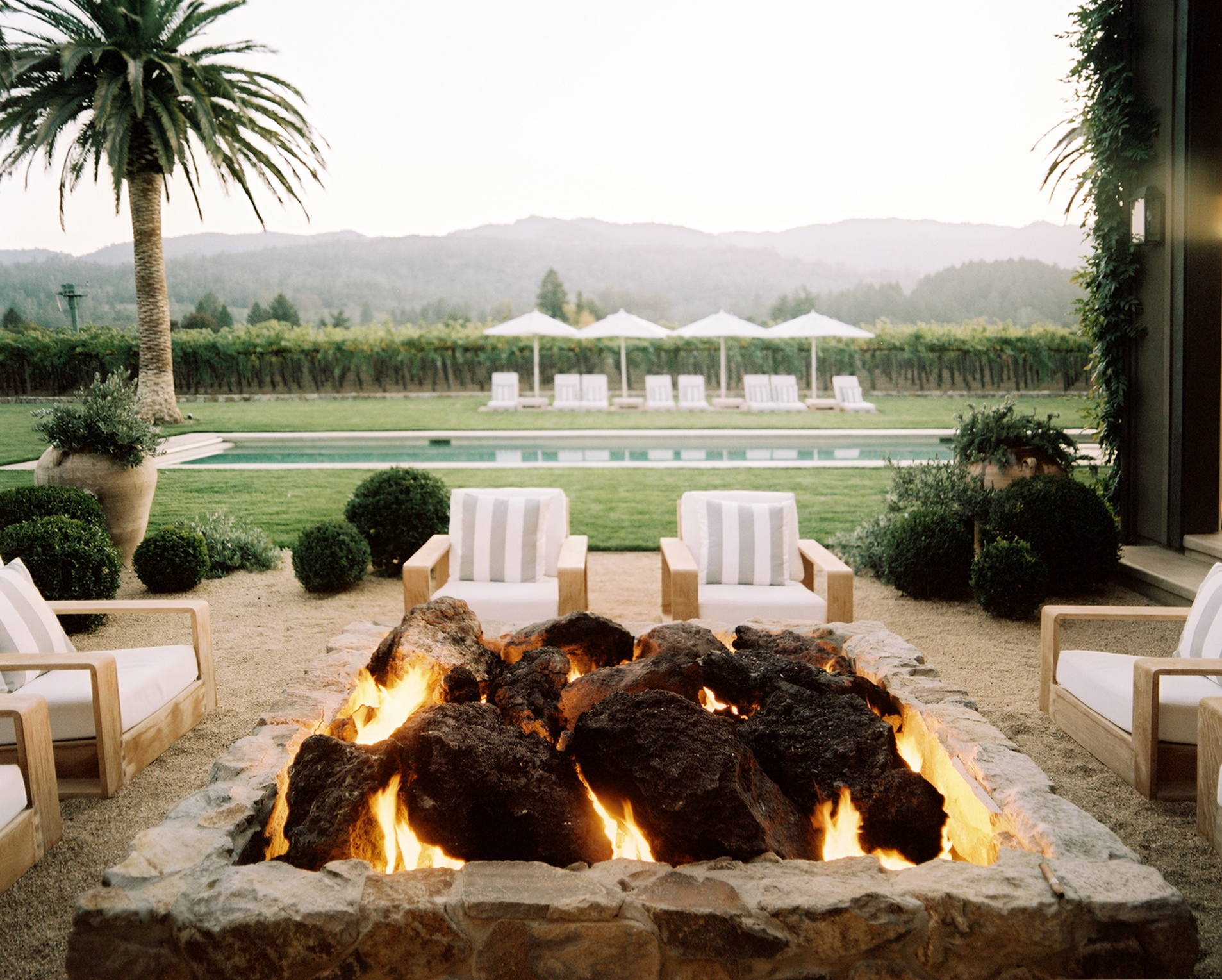 Contento Napa Valley terrace and fire pit overlooking the vineyard by Hillary Thomas