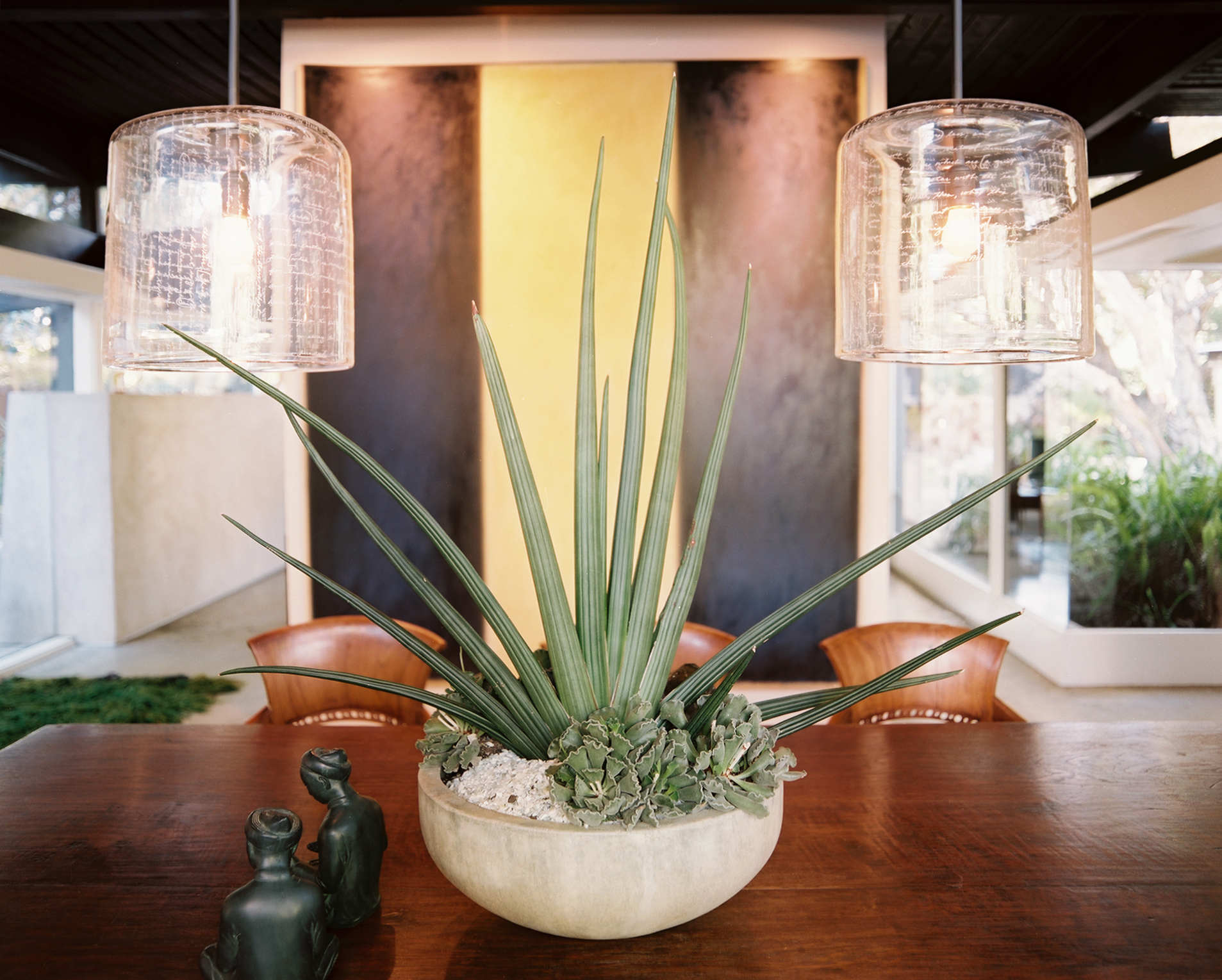 Midcentury Modern Retreat dining area opening to the garden by Hillary Thomas