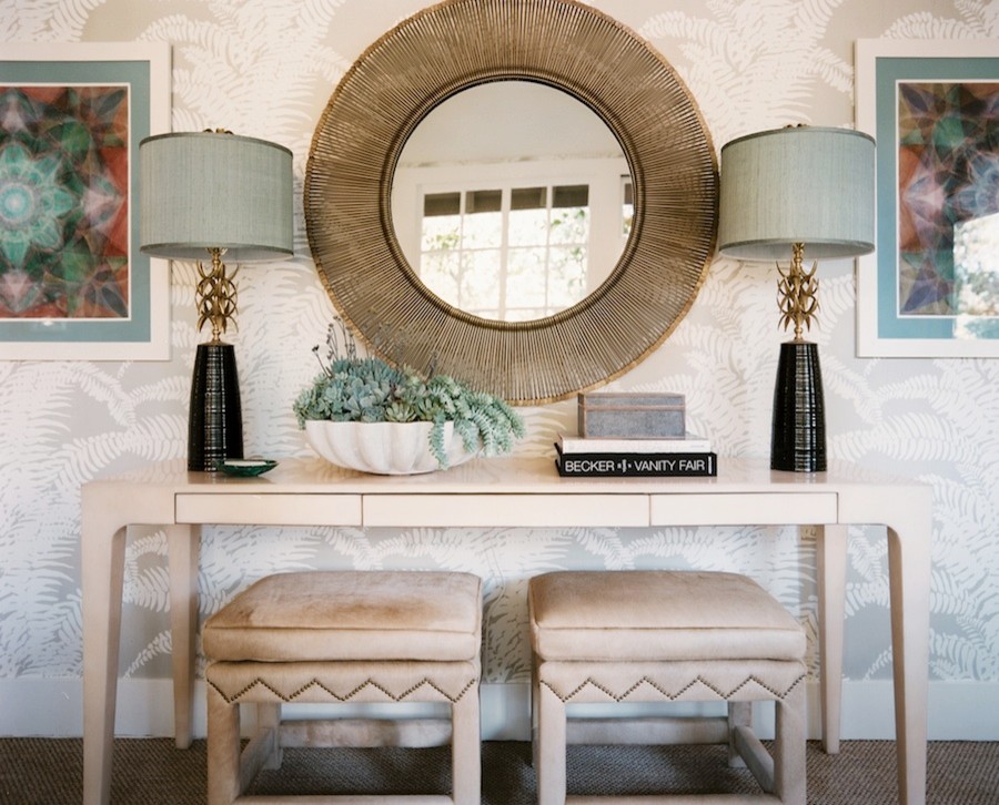 Napa Valley Showhouse console vignette with sunburst mirror and velvet stools by Hillary Thomas