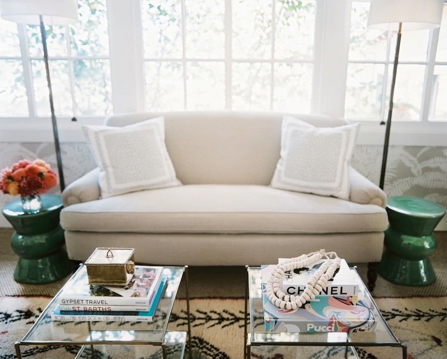 Napa Valley Showhouse sofa flanked by green garden stools by Hillary Thomas
