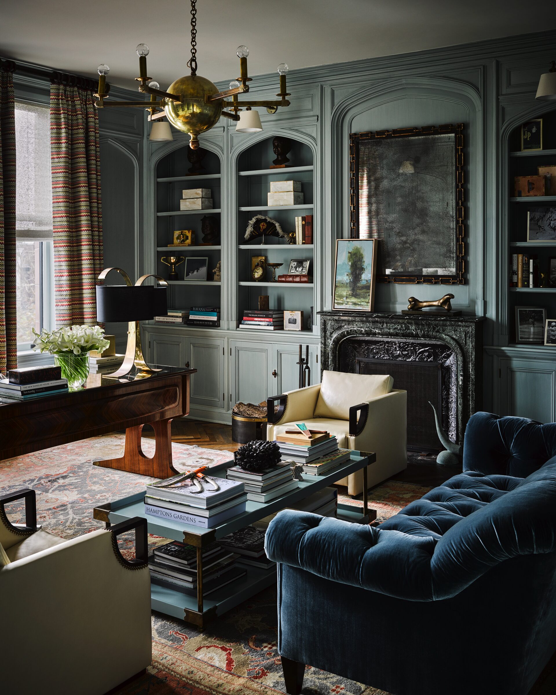 San Francisco Tudor library with built-in shelving and velvet seating by Hillary Thomas