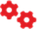Two red interlocking gears with one smaller gear behind a larger gear.