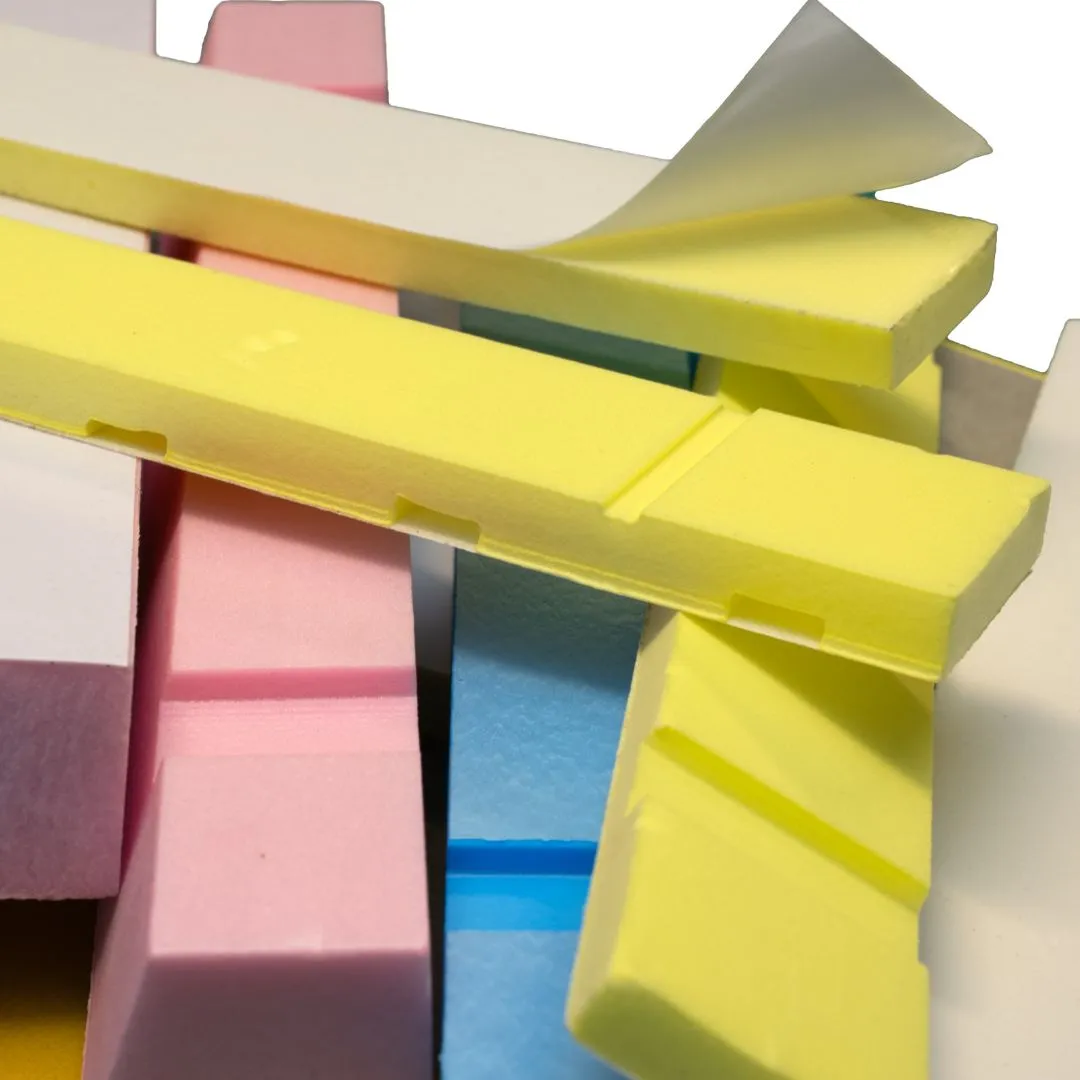 Stacked blocks of Cavi-Strips in yellow, pink, white, and blue showing different thicknesses.