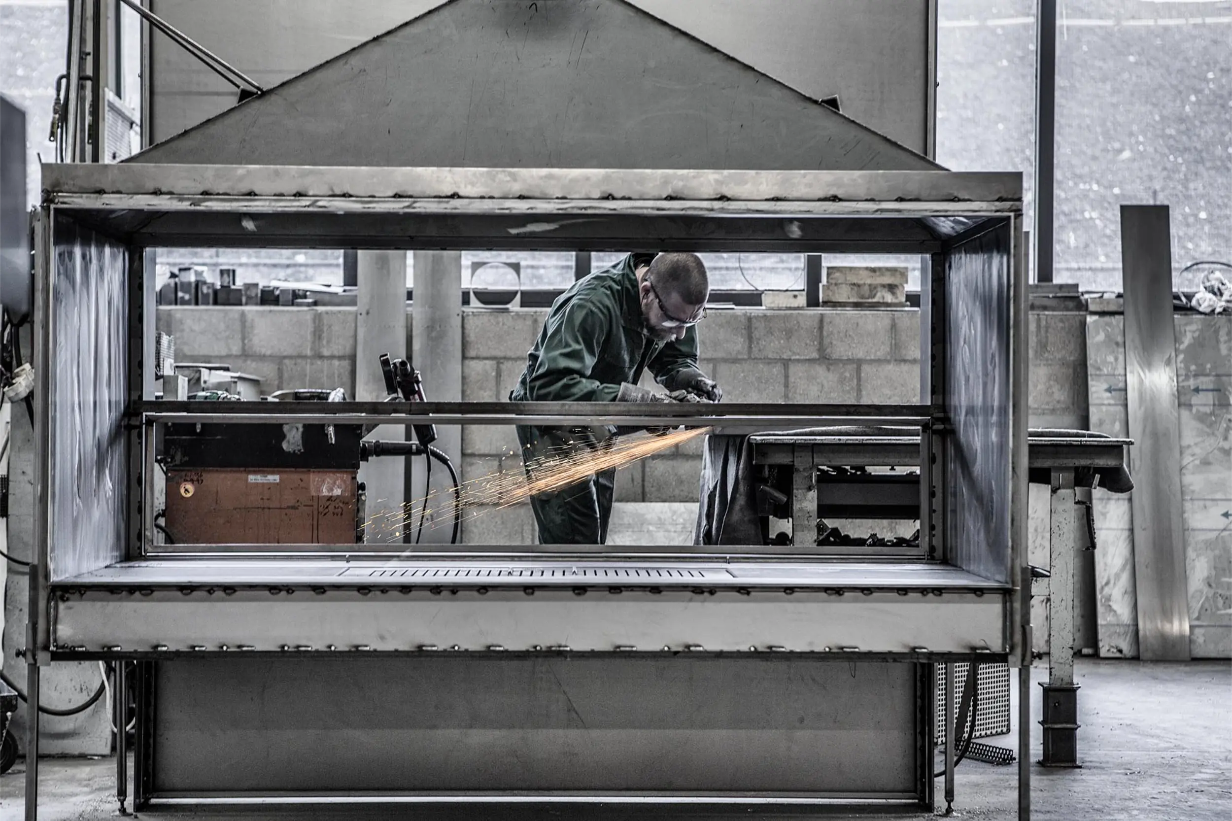 Man fabricating bespoke fireplace for Modus Fireplaces