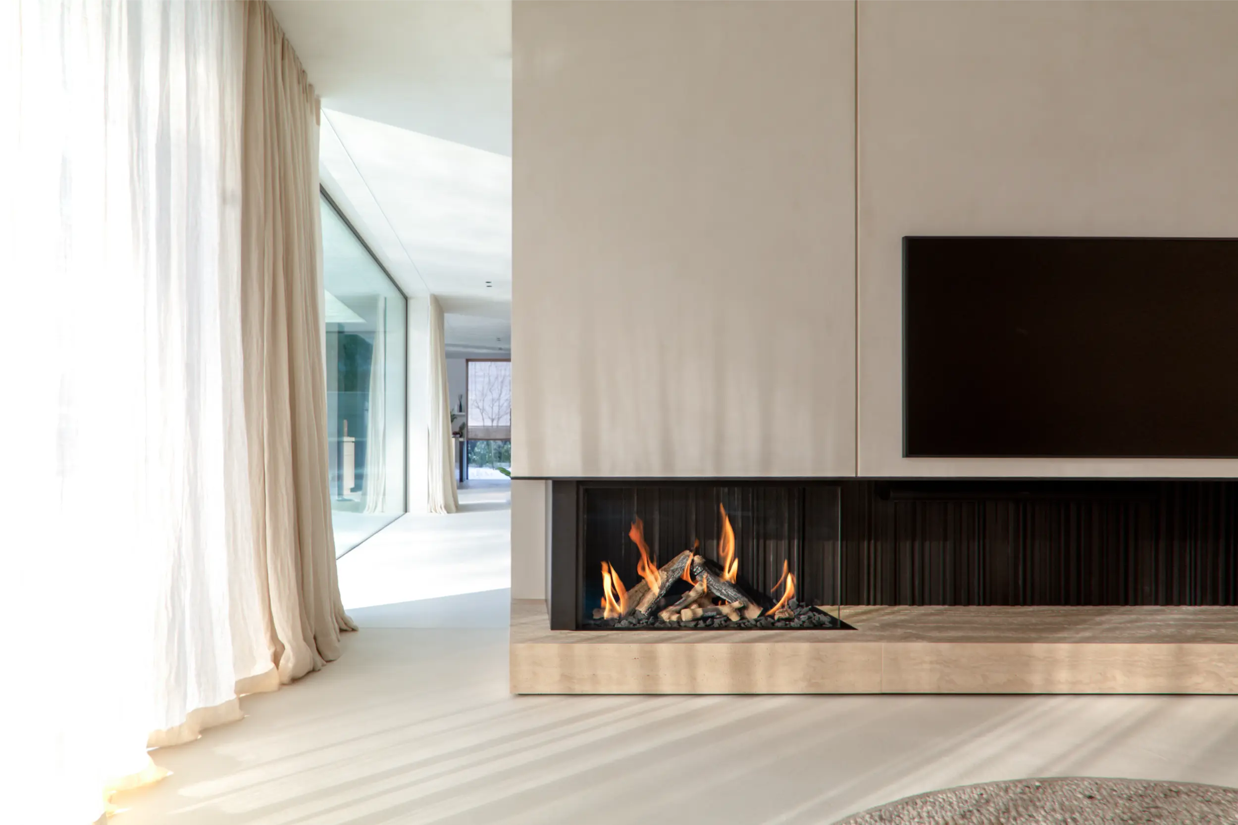 Glass enclosed bioethanol fireplace by Modus Fireplaces