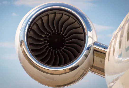 Close-up of a jet engine turbine with blades 