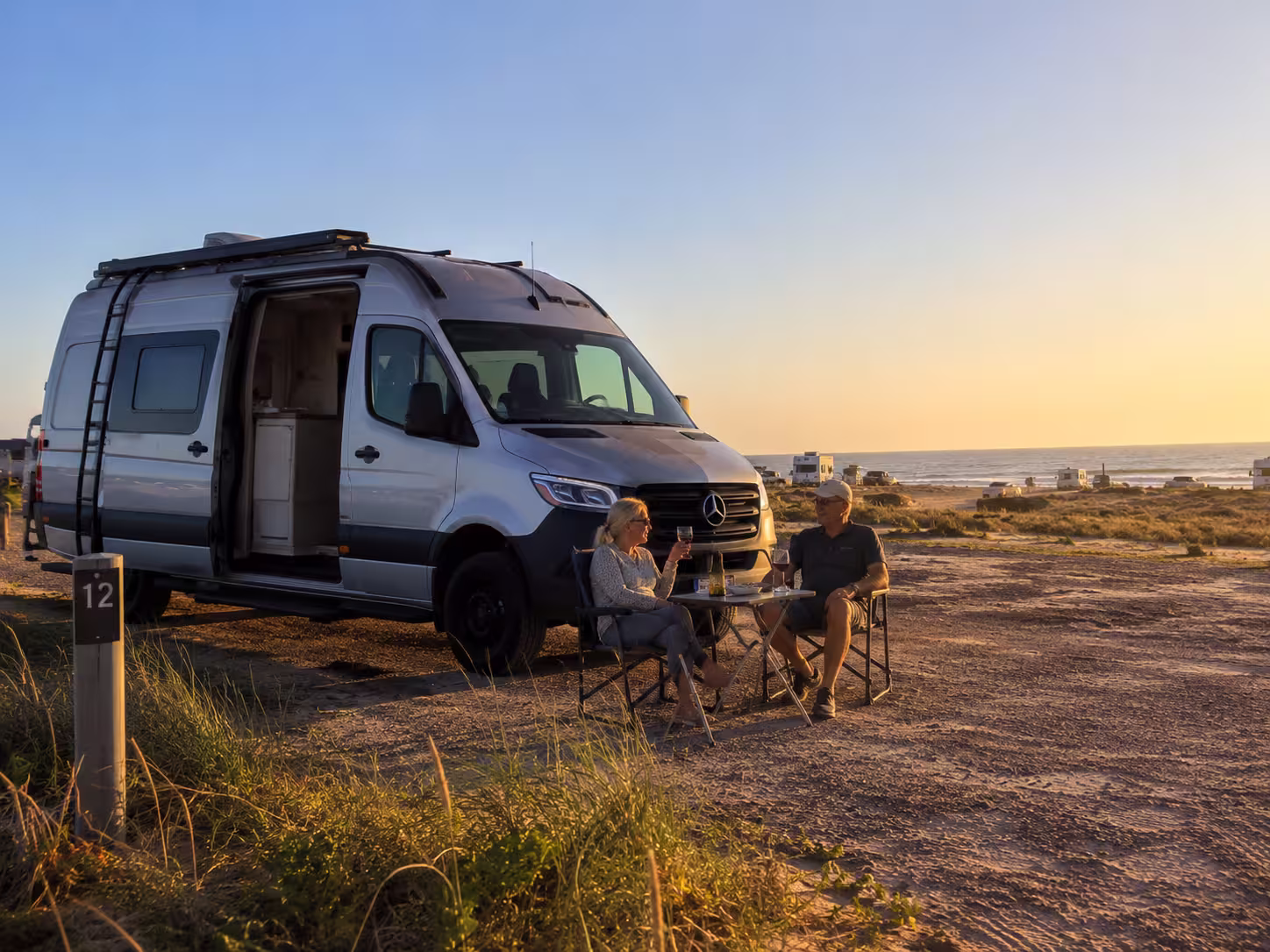 Couple at a Class B camper van campsite near Nags Head