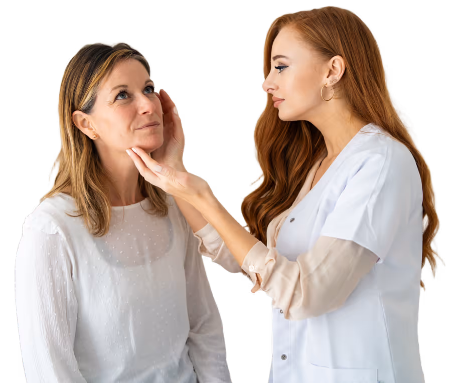 Healthcare professional examining a patient's jaw and face in a clinical setting.