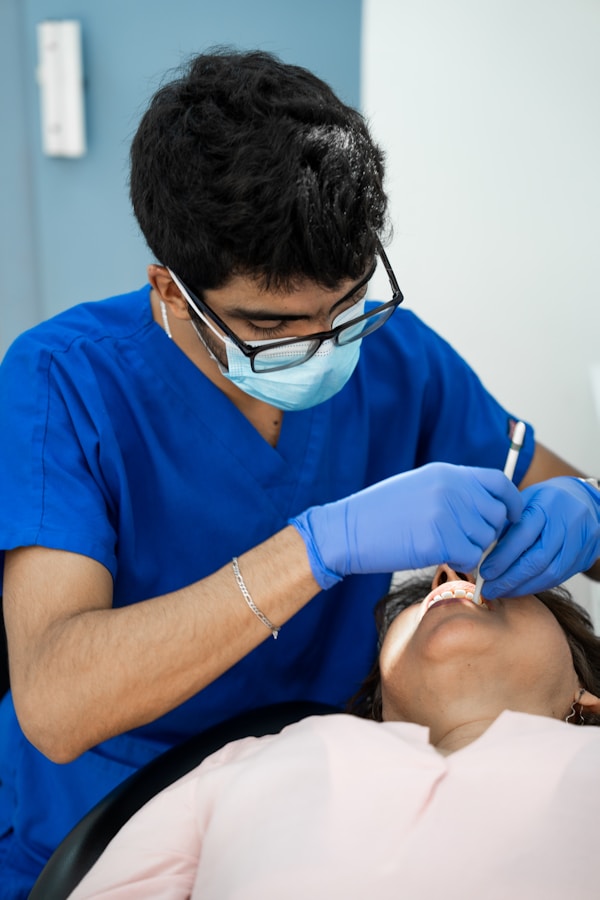 A dentist is providing medical treatment to a patient.