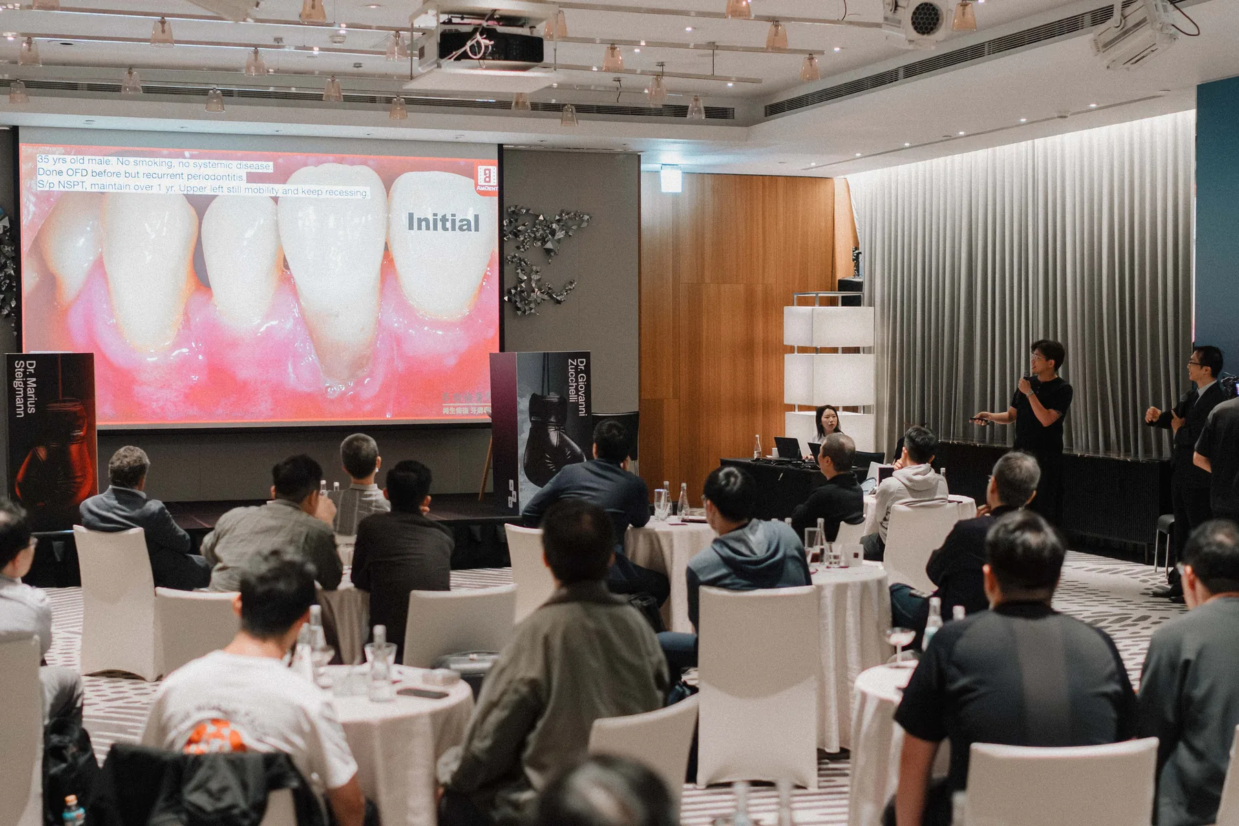 An instructor discusses dental images with participants