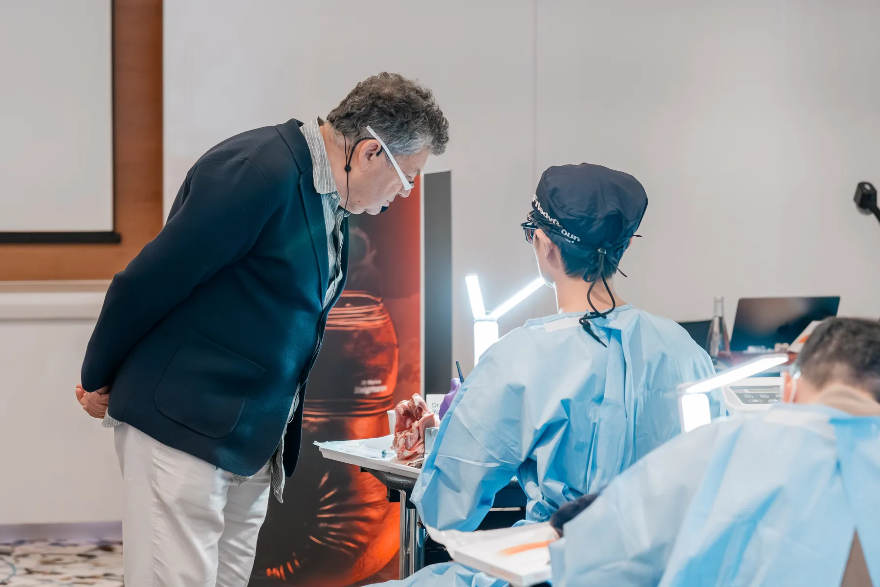 An instructor guides a participant during hands-on training