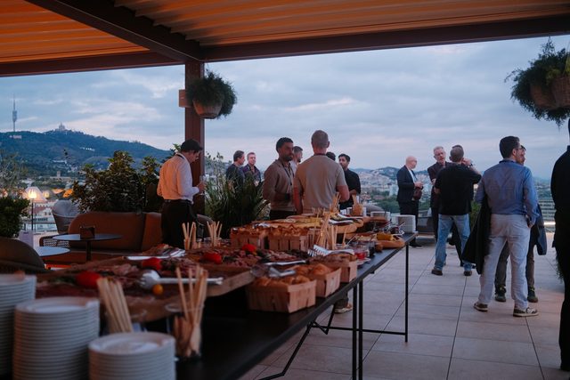 Welcome drinks on a rooftop terrace overlooking Barcelona