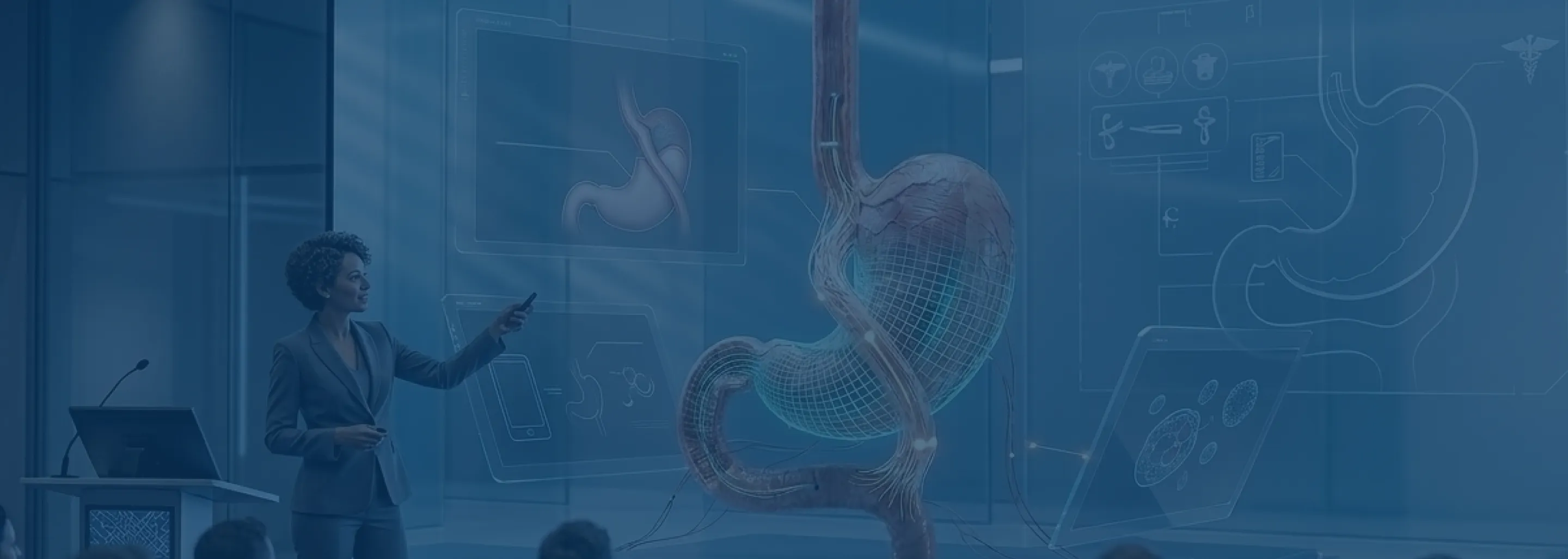 A woman in a business suit points at a large transparent 3D digital model of a stomach displayed in a futuristic medical presentation with other anatomical diagrams floating around.