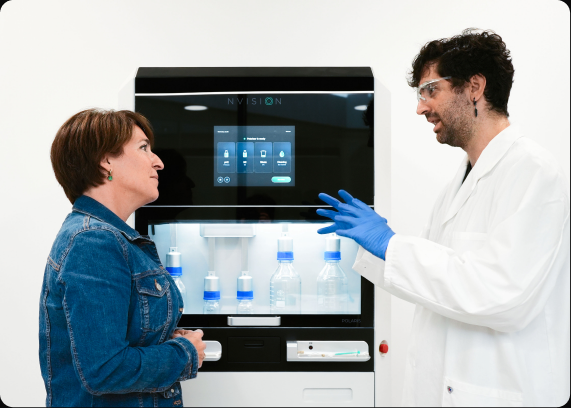 Two researchers discussing the POLARIS system in a laboratory