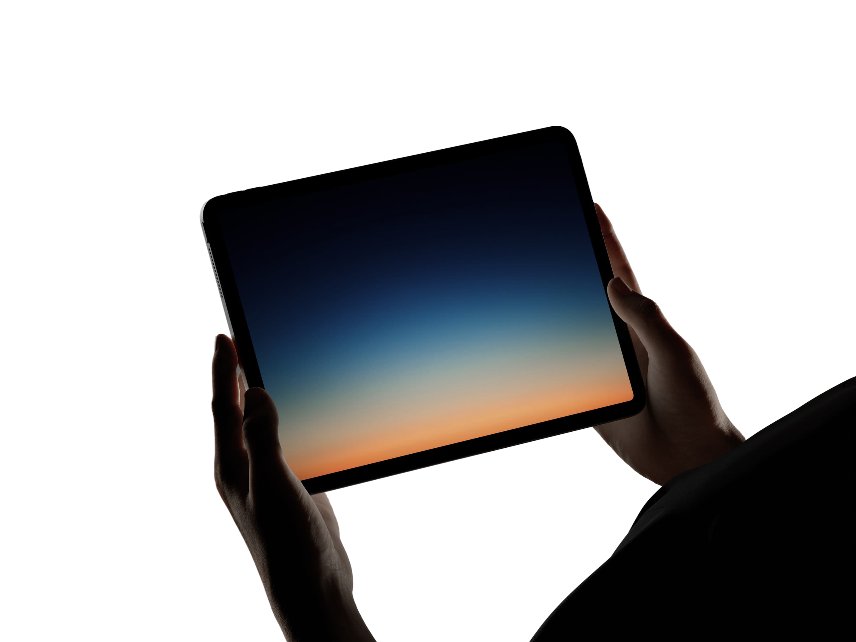 Person holding phone against a sunset sky