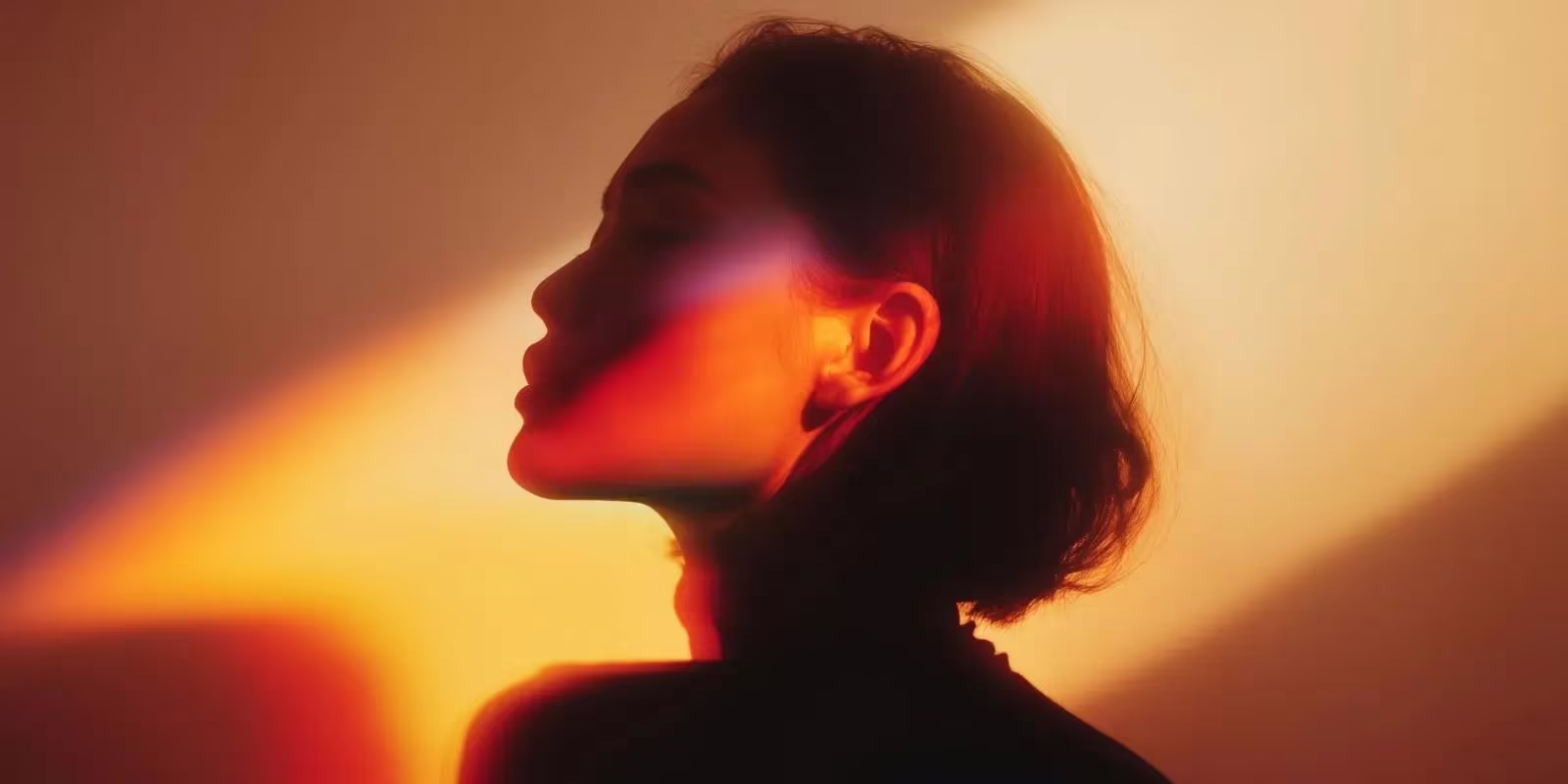 Portrait lit in warm orange light