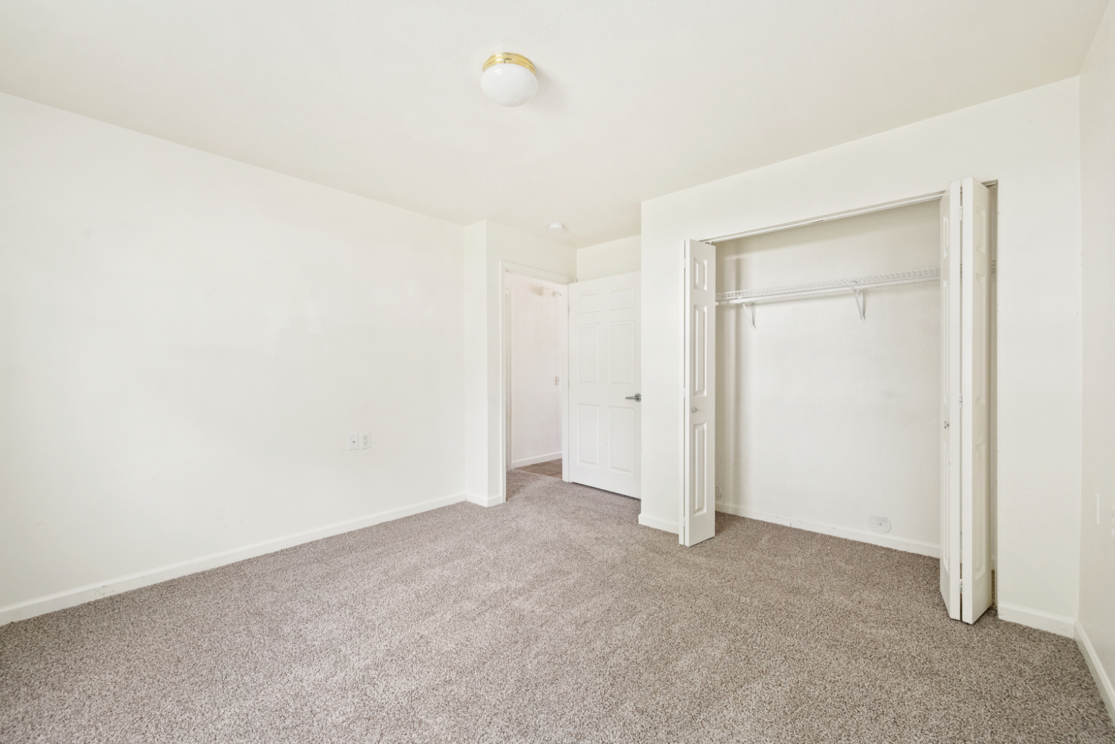 Unfurnished bedroom with large closet