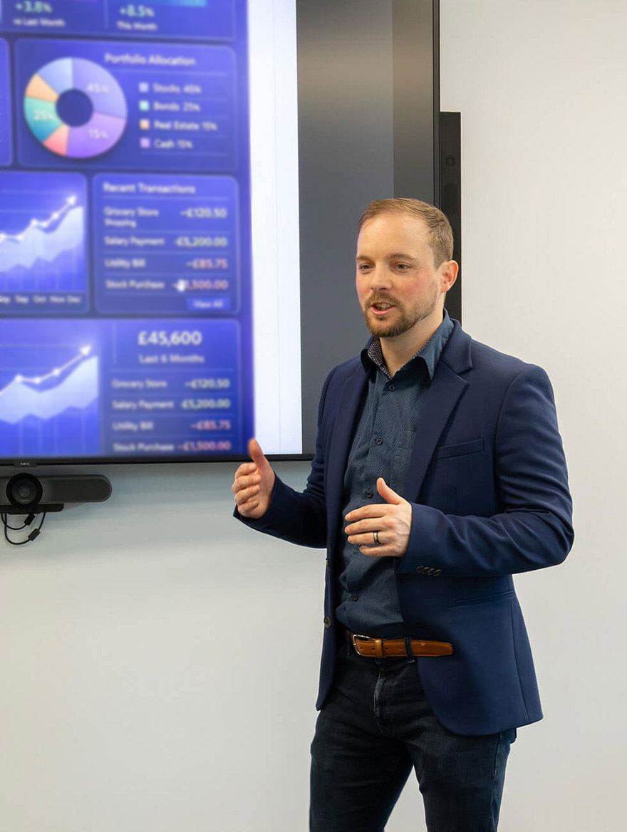 Kieran presenting financial findings in a meeting