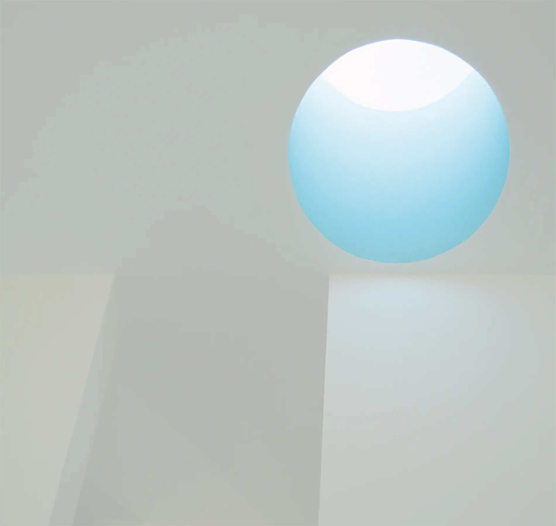 An elliptical rooflight lined with a high gloss pigment amplifies the sky colour at the golden hour and serves as a salute to a James Turrell sky piece.