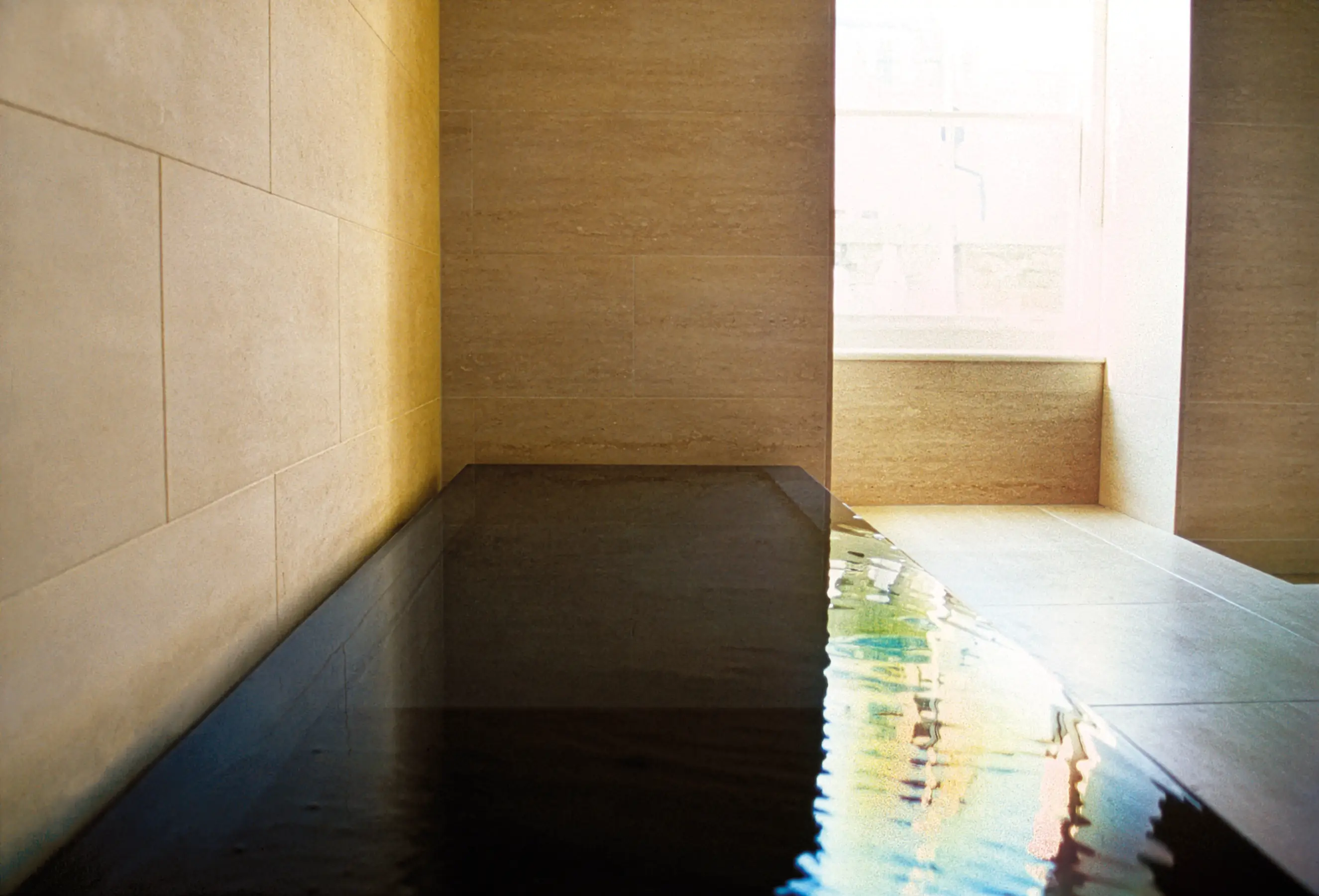 Designed to fill to overflowing. Liquid appears solid, evoking a Richard Wilson installation and blending art with function.