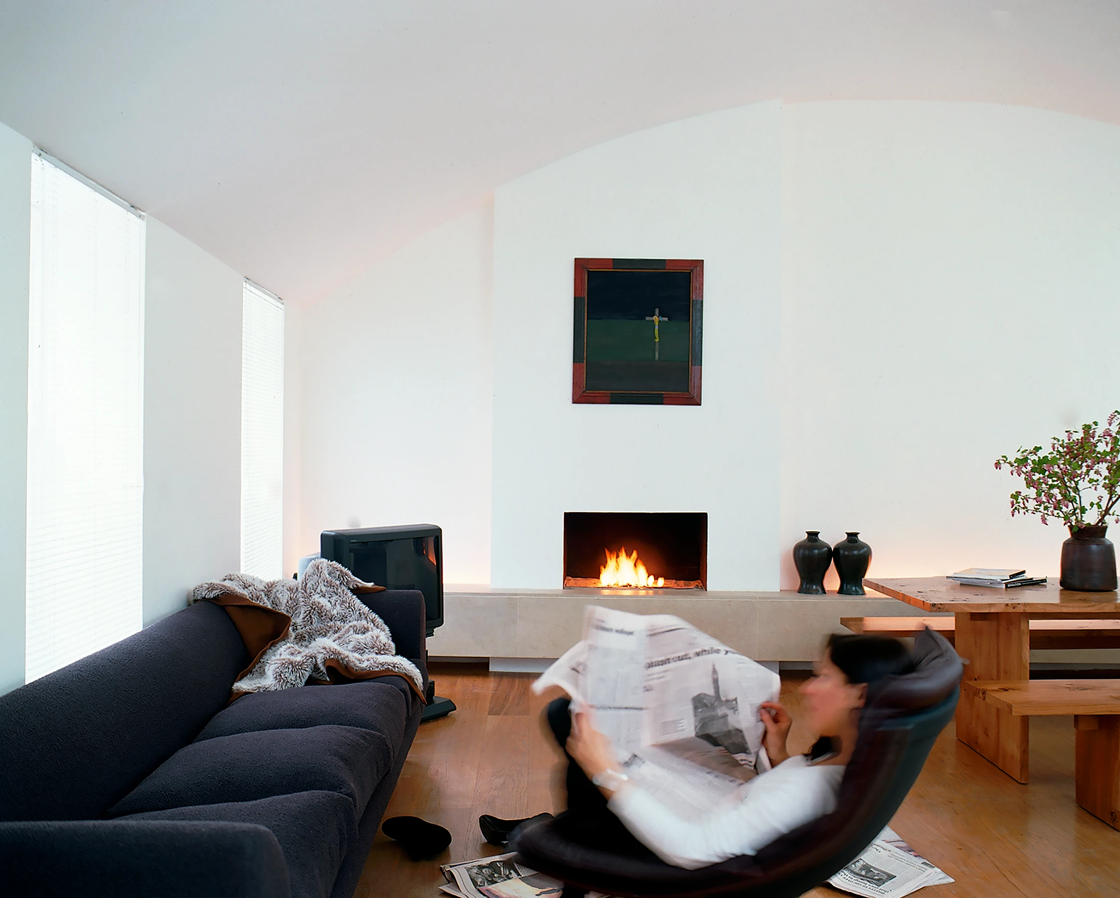 The new setback roof profile allowed us to bring light down into the back reception room and the 12m deep lower floors. Weightless white walls float above the bespoke oak flooring, and the loose furniture made from the same wood completes the simplicity.