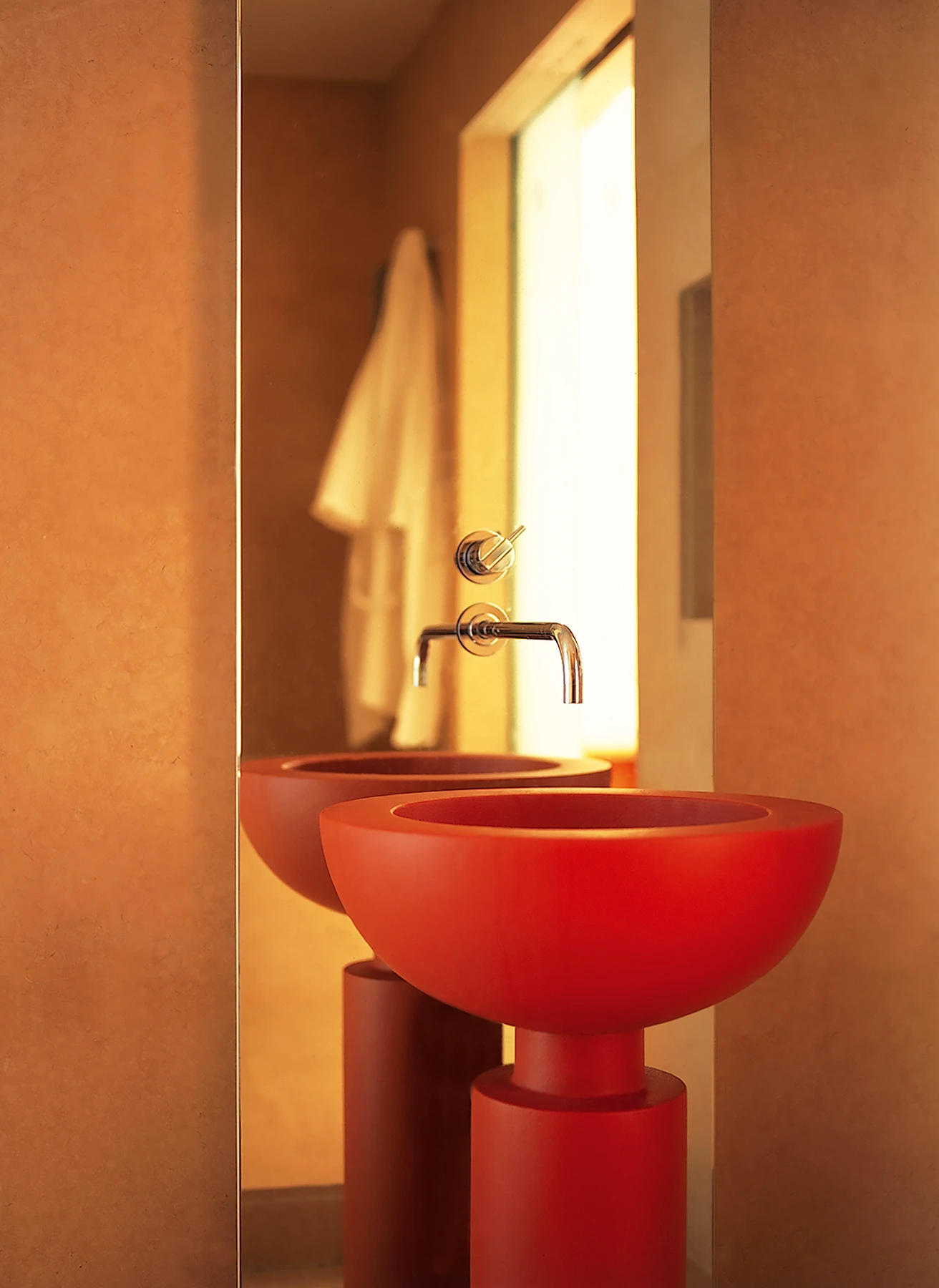 The bathroom, while compact, has light from 2 sides, a double-ended bath, a generous shower and font as a wash hand basin.