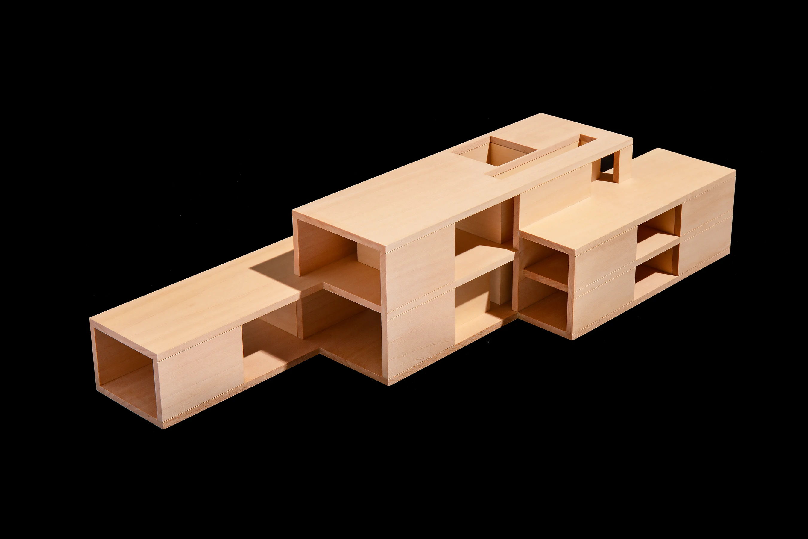 Model viewed from the public domain, showing the interlocking volumes and grander-scale formal reception spaces.