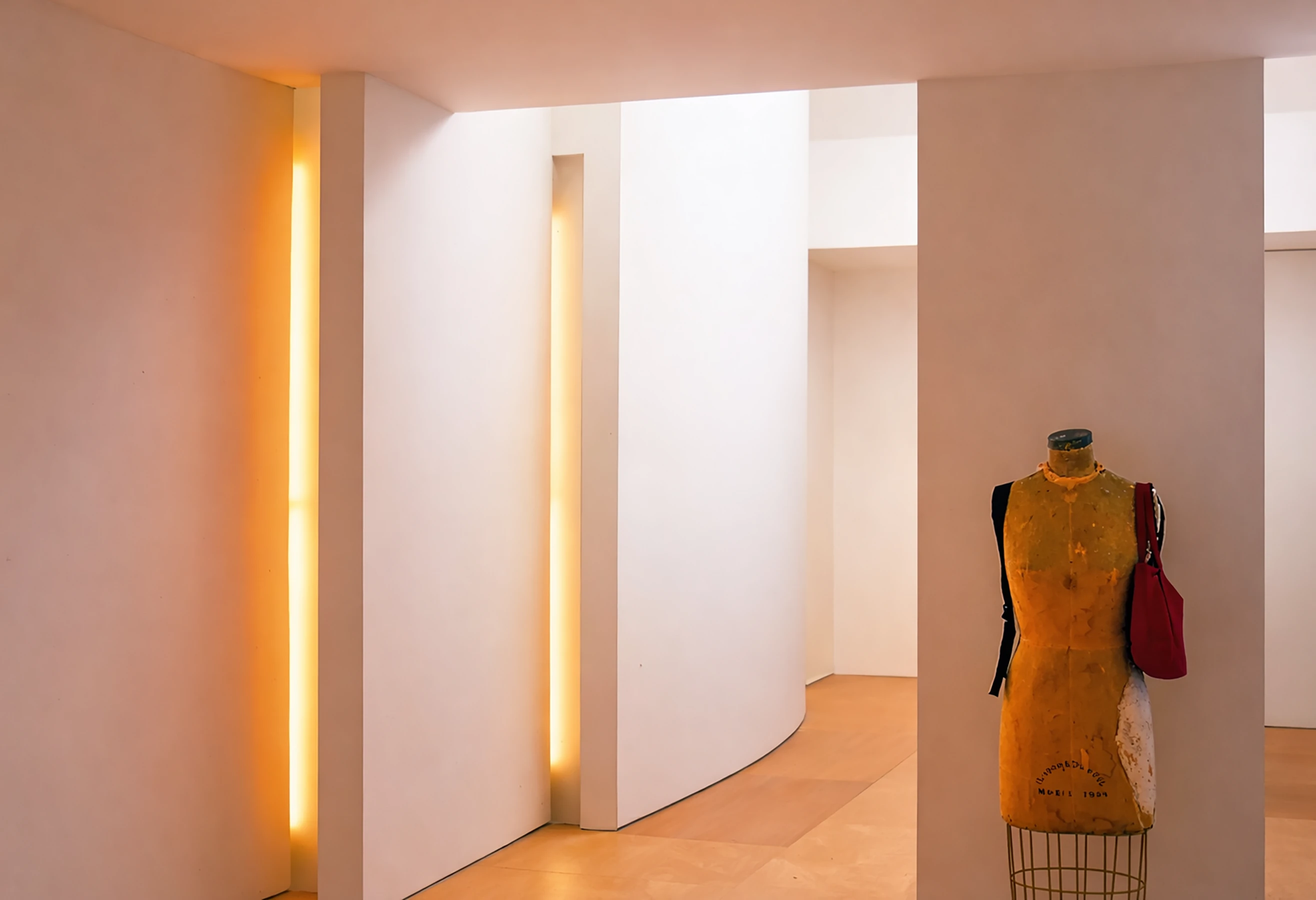 By placing a galley above the main space, set back from the front and rear, with stepped and curved balcony edges, we were able to create a double-height entrance hall and main reception, along with a vaulted principal bedroom.