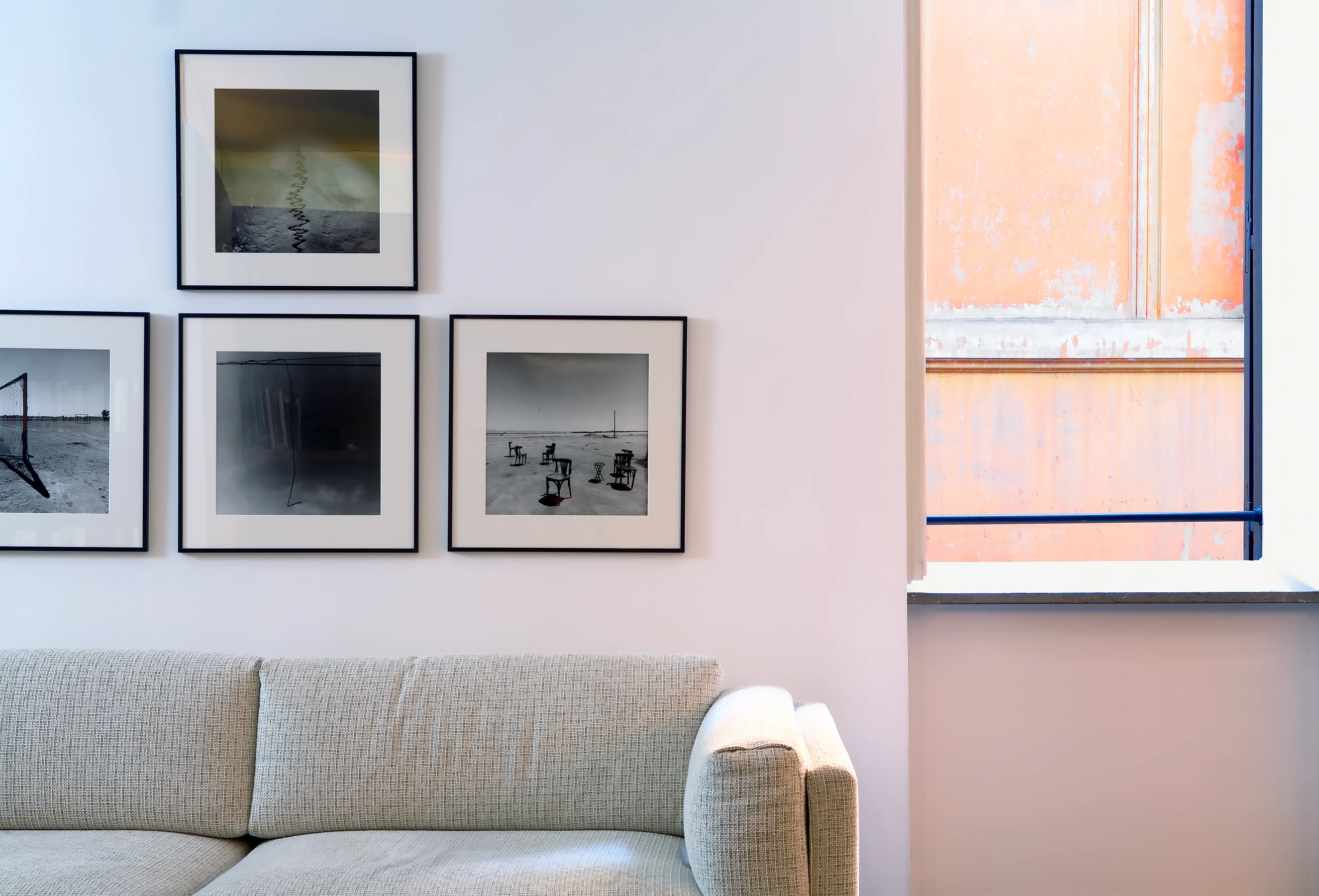 The crisp interior contrasts with the historic patination of the burnt sienna stucco street.