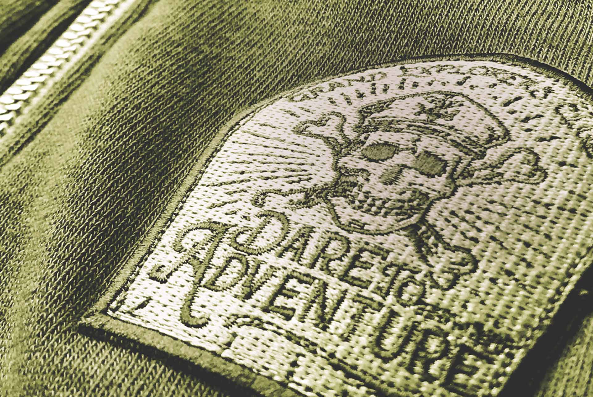 J. James branded patch embroidered on olive fleece
