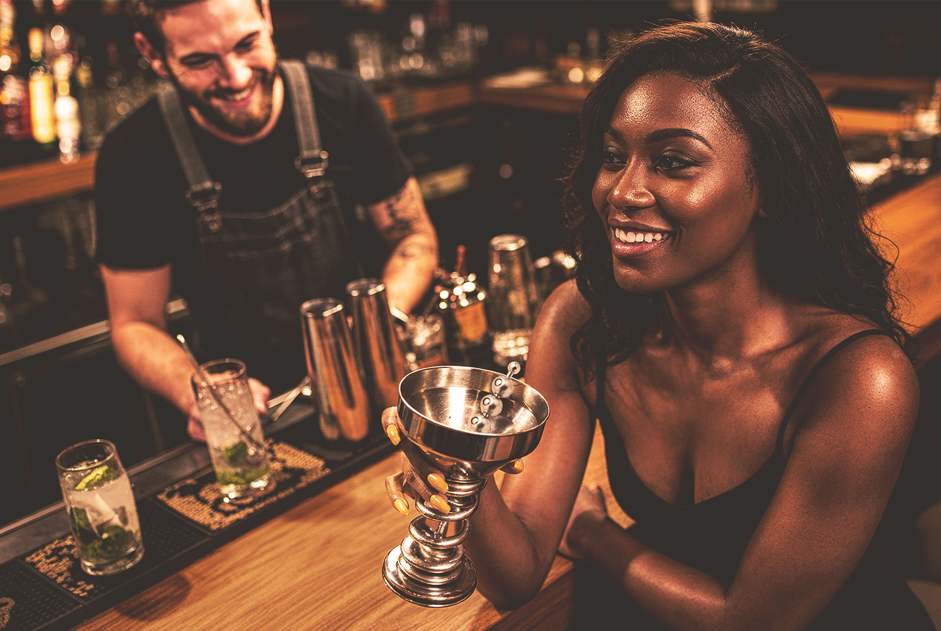 Gearbox metal drinkware in a garage-bar lifestyle scene