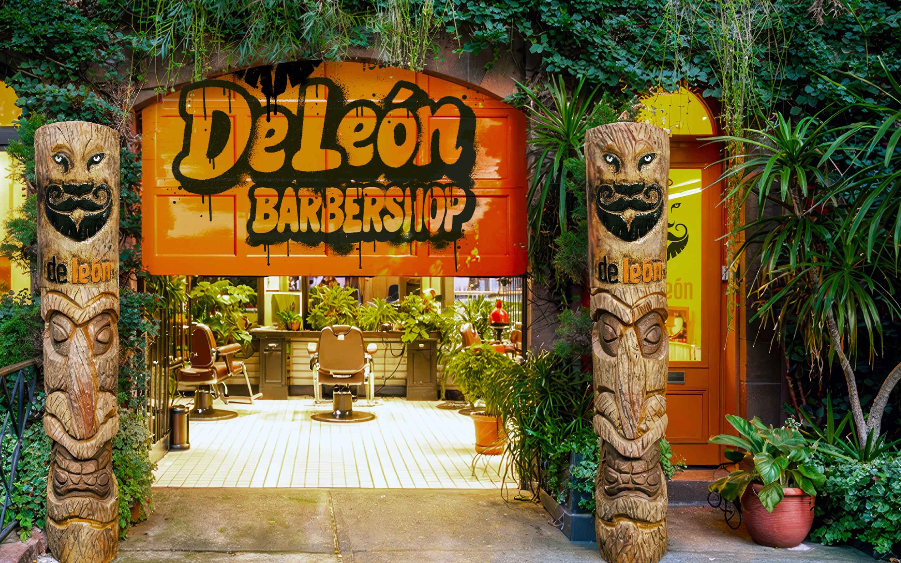 De León Barbershop lion-mane logo on storefront signage