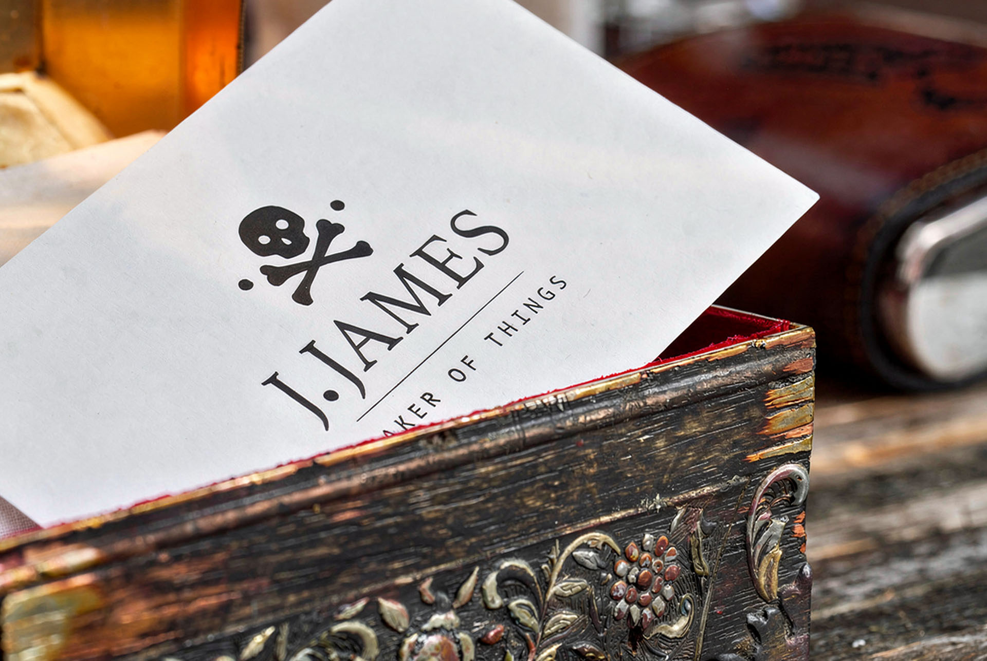 J. James business card with skull logo