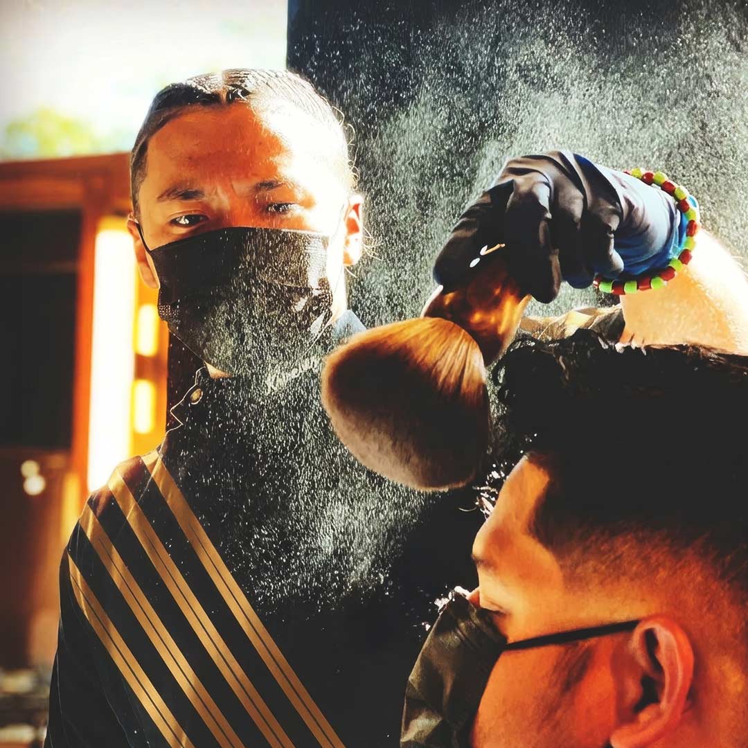 The Anguished Barber barber styling a client