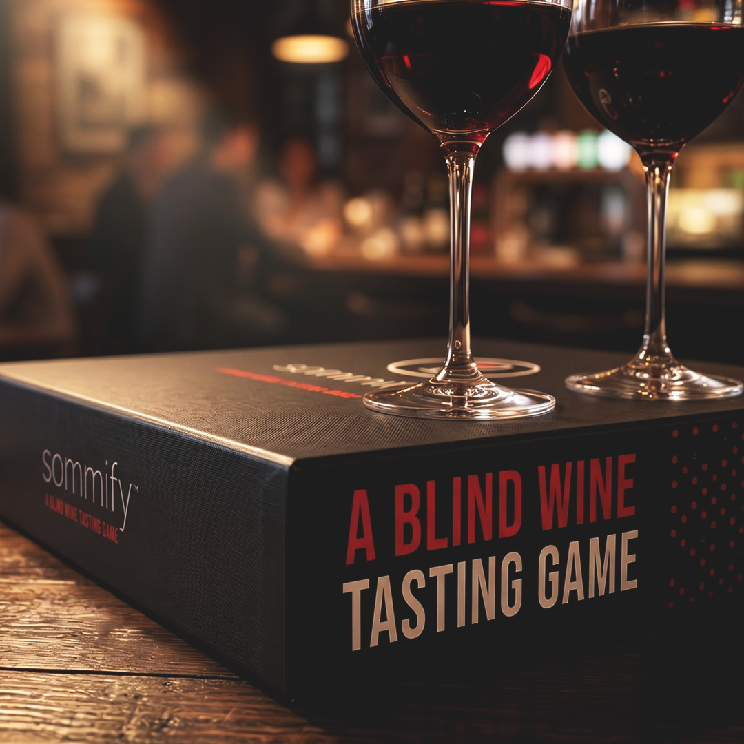 Sommify game packaging on a bar with wine
