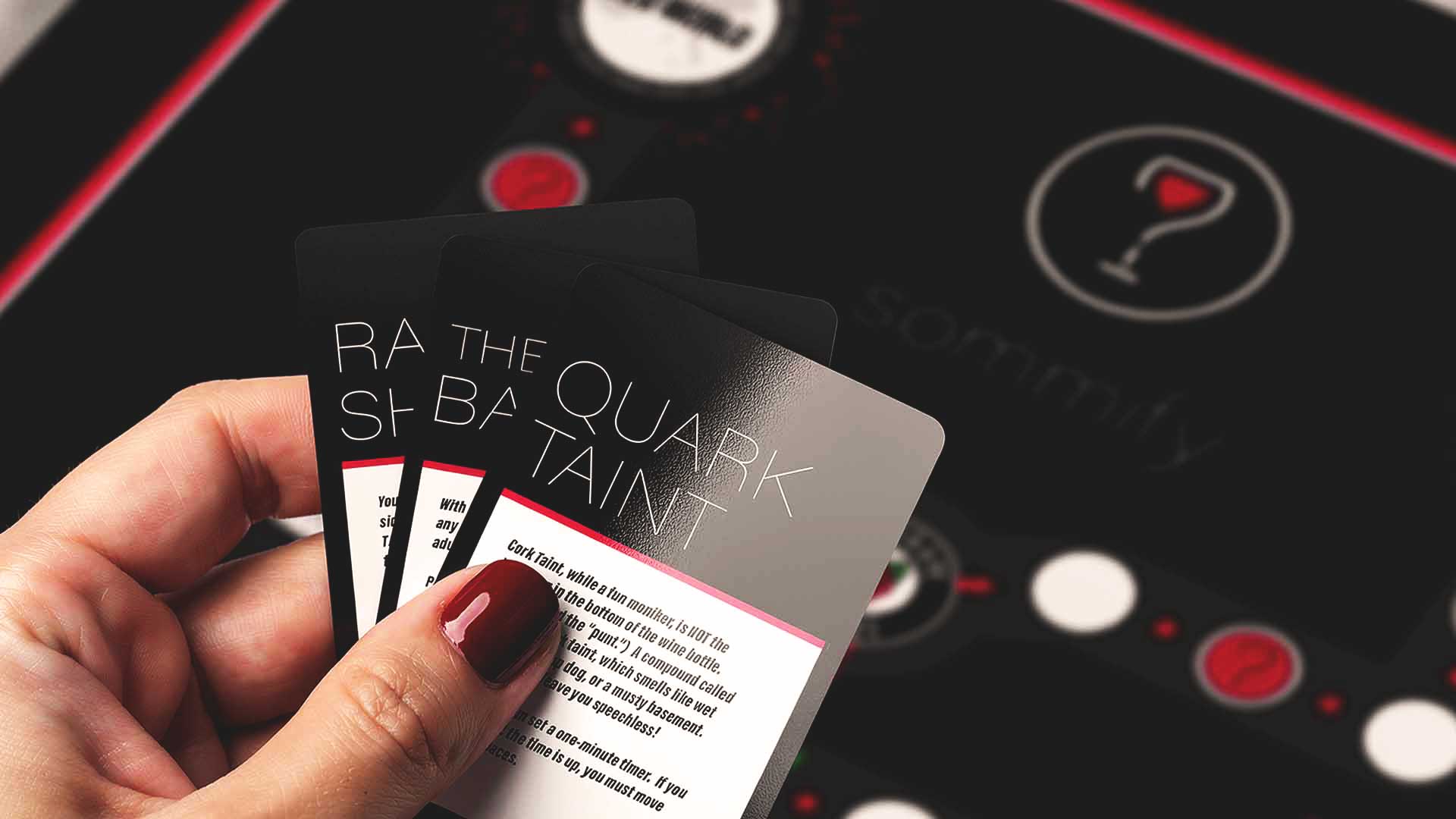 Sommify wine-tasting game cards in hand