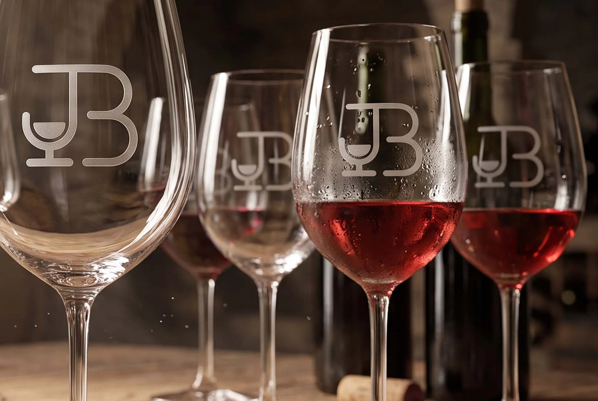 The Jessica Bush monogram etched on a row of wine glasses